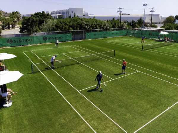 A tennis court inside Apollo Blue 5 star hotel in Rhodes awaits tennis lovers