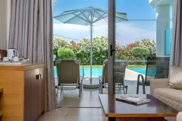 Interior view of the private terrace leading onto private pool at Apollo Blue Hotel