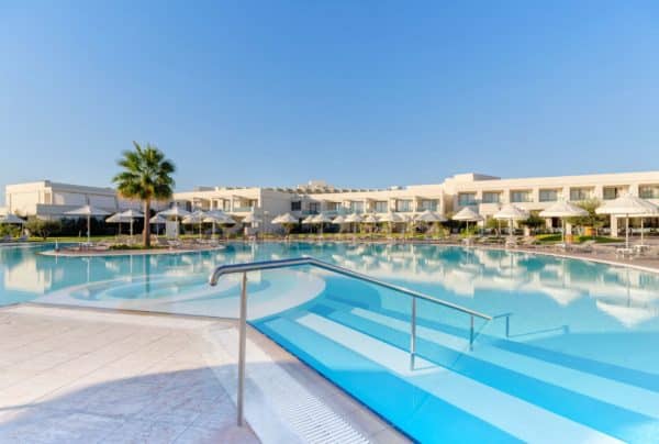 Swimming pool at Apollo Blue and building in the background