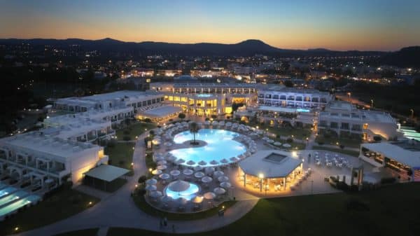 Apollo Blue Hotel building and facilities with a sunset backdrop