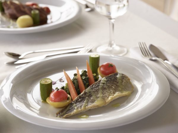 Healthy dishes at Apollo Blue Hotel, seared fish fillet served with vegetables