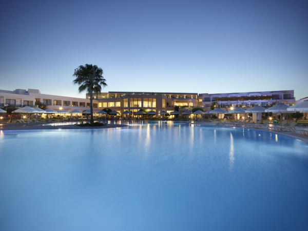 The main swimming pool of Apollo Blue Hotel just before sundown