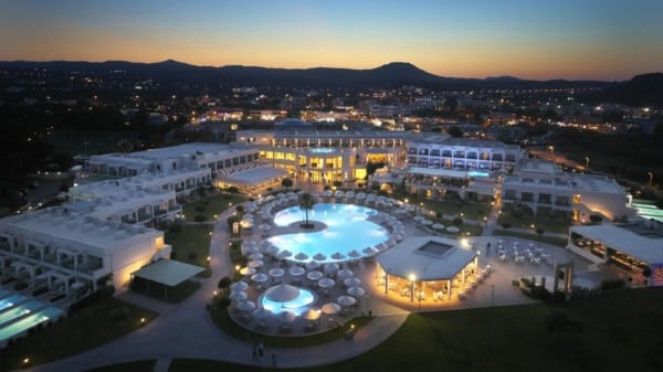 Apollo Blue Hotel from above showing all facilities with a sunset backdrop