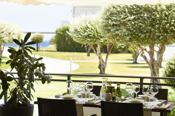 Elegantly decorated table waiting for guests to start a delicious lunch at Apollo Blue Hotel