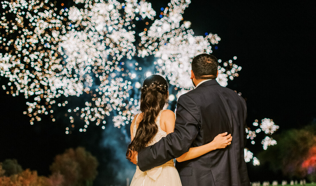 Bride and groom enjoying the fireworks at Apollo Blue Hotel