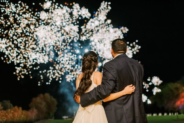 Bride and groom enjoying the fireworks at Apollo Blue Hotel